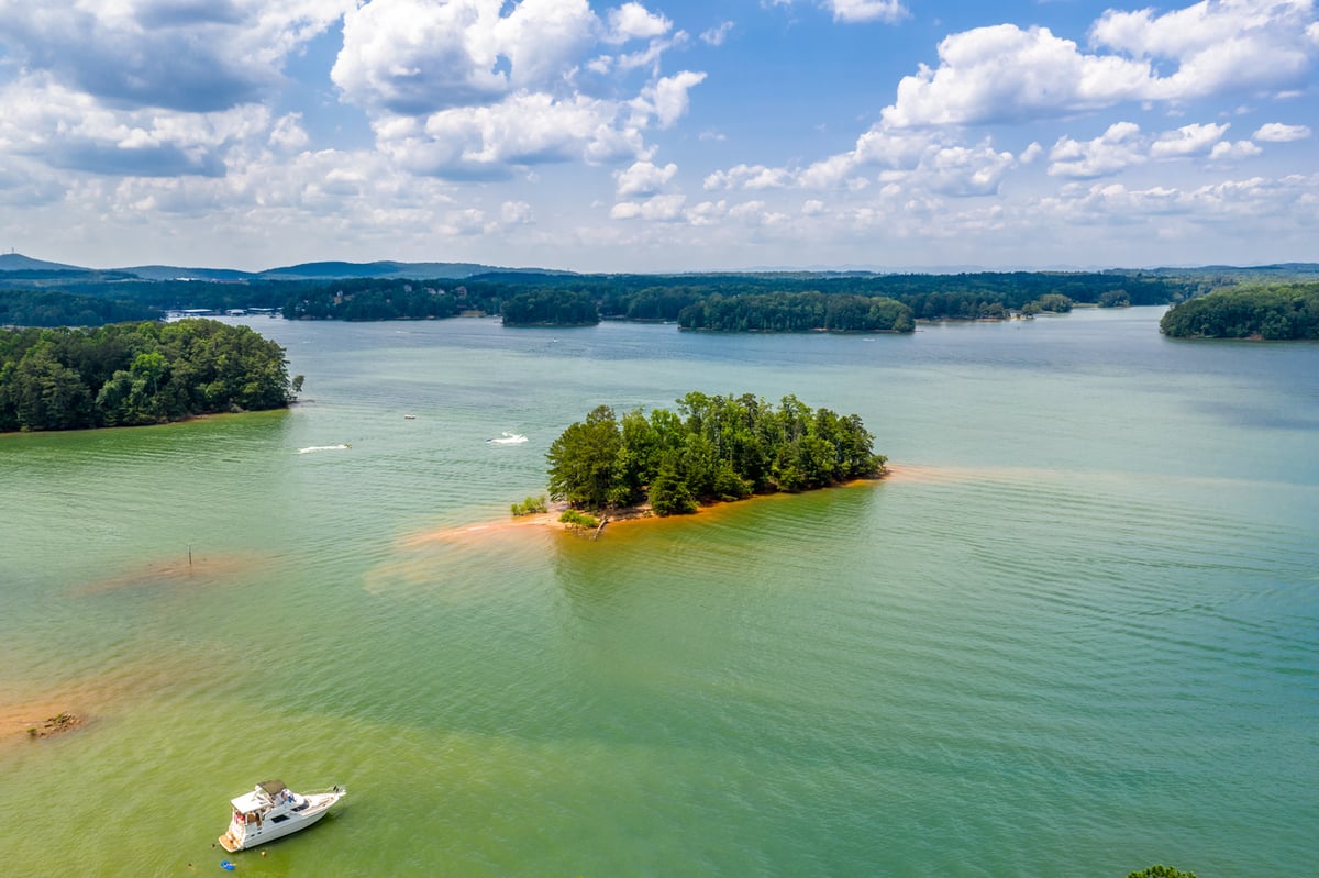 aerial view of lake with boat 